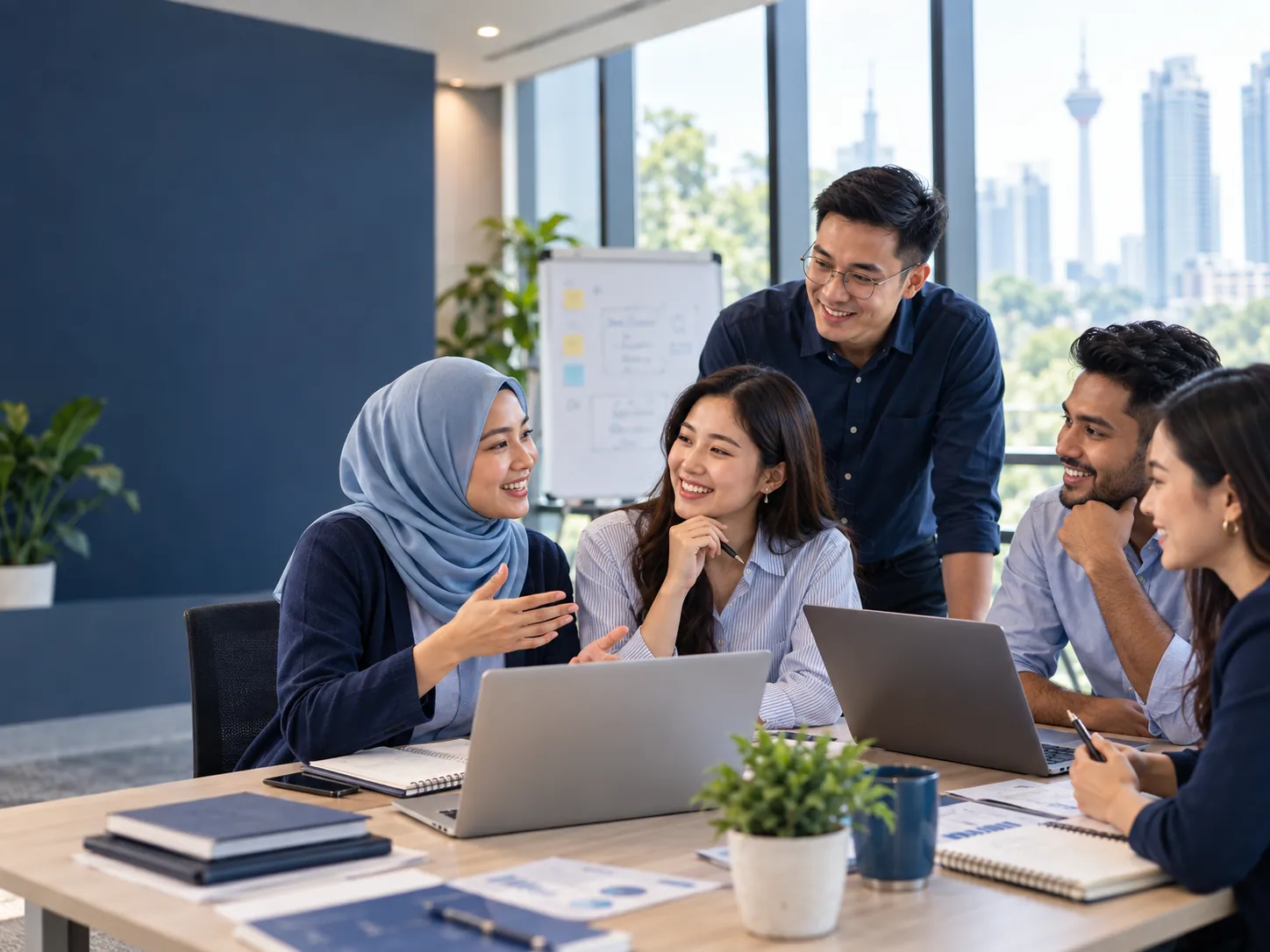 Diverse Malaysian team learning together in person